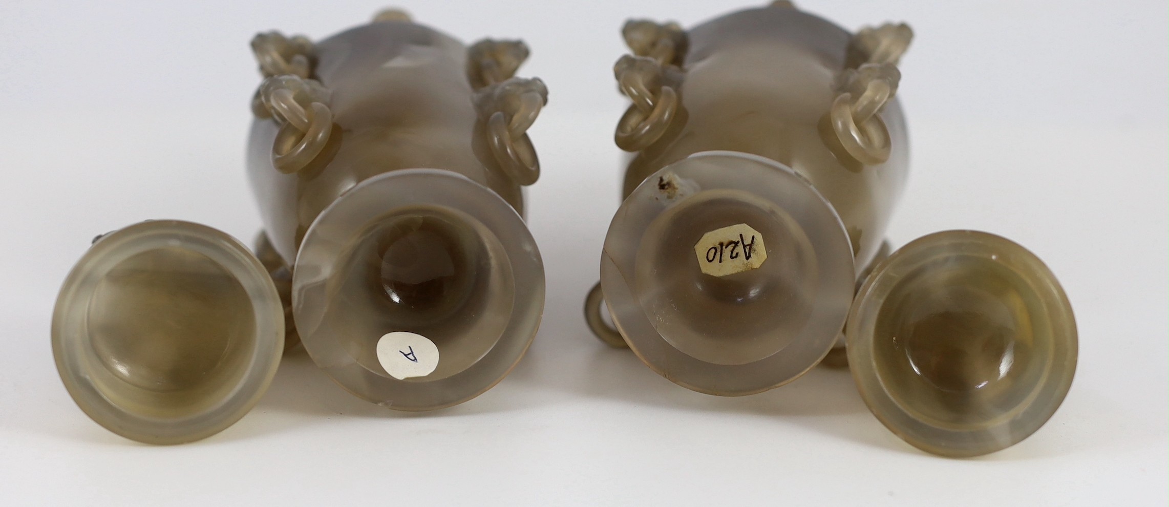 A pair of Chinese agate vases and covers, early 20th century, 19.5cm high, chip to one lion